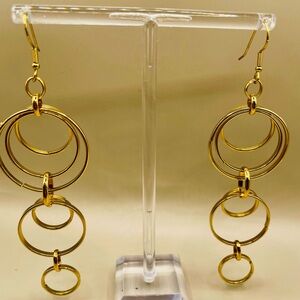 Big long multiple hoop dangle earrings. Gold tone. Lightweight.